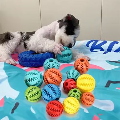 Buy Pet Dog Rubber Treat Dispensing Ball Hiding Food Puzzle Bite Interactive Pet Ball Chew online manufacture